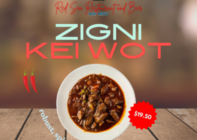 Description: Hot Zigni Kei Wot features delectable beef chunks simmered in a robust red pepper sauce infused with exotic homemade spices. It's a flavorful and aromatic Ethiopian dish known for its rich flavors and hearty preparation. Robust, spicy, aromatic. Ingredients: Beef chunks, red pepper sauce, homemade spices. Taste: The dish offers a bold and spicy flavor from the red pepper sauce, with a complex blend of exotic spices that enhance the savory taste of the beef chunks. The simmering process ensures tender meat infused with the deep flavors of the sauce and spices, providing a satisfying and flavorful experience. Allergens: None specified Price: $19.50 ALT text: Delectable beef chunks simmered in spicy red pepper sauce with exotic homemade spices. Flavorful Ethiopian cuisine.