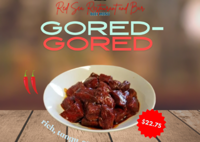 Description: Hot Gored Gored features top round beef sautéed in spiced butter and lemon juice, served slightly cooked. It's a traditional Ethiopian dish known for its bold flavors and unique preparation. Rich, tangy, savory. Ingredients: Top round beef, spiced butter, lemon juice, spices. Taste: This dish offers a rich and buttery flavor from the spiced butter, with a tangy twist from the lemon juice that enhances the savory taste of the top round beef. Served slightly cooked, it retains its tender texture while delivering a satisfying blend of spices and citrus notes. Allergens: Contains dairy (spiced butter). Price: $19.95 ALT text: Top round beef sautéed in spiced butter and lemon juice, served slightly cooked. Bold and flavorful Ethiopian cuisine.