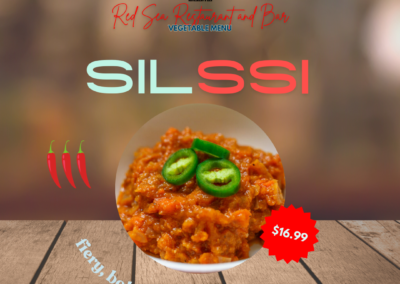 Description: Silssi is perfect for those who delight in hot and spicy flavors! This dish is prepared with a liberal amount of onions, creating a robust and fiery Ethiopian specialty that is sure to satisfy spice enthusiasts. Fiery, bold, flavorful. Ingredients: Onions, spices, oil or butter. Taste: The dish offers a bold and intense heat, with the spicy elements creating a fiery sensation on the palate. The abundant onions add sweetness and a caramelized depth that balances the spice, making each bite a complex and flavorful experience. Allergens: None specified Price: $16.99 ALT text: Spicy Ethiopian dish with a liberal amount of onions. Perfect for those who delight in hot and fiery flavors.